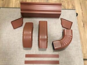 A Residential Colonial Red Gutter Installation by Affordable Roofing & Gutter Company in Eugene, Oregon